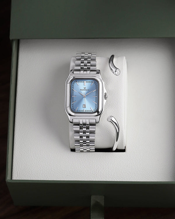 lifestyle_image, A square womens watch in 316L stainless steel from Waldor & Co. with blue Diamond Cut Sapphire Crystal glass dial. Seiko movement. The model is Delight 32 Chelsea