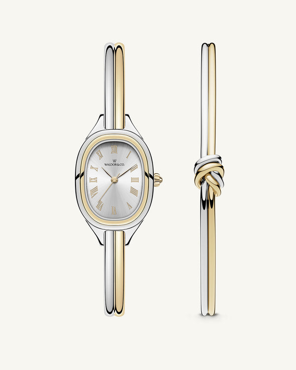 An ellipse shaped womens watch in Rhodium-plated 316L stainless steel from Waldor & Co. with silver sunray dial in brass. Mineral glass with sapphire crystal coating. Seiko movement. The model is Dual Bangle Watch.