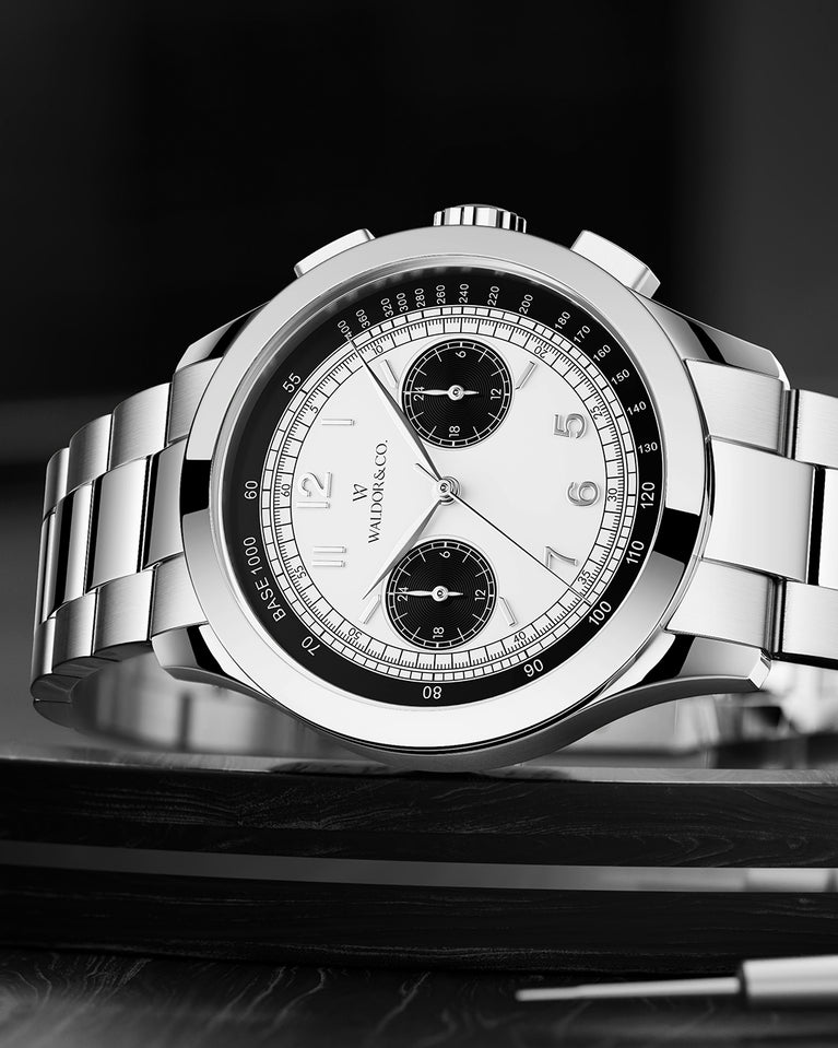 A round mens watch in rhodium-plated silver from Waldor & Co. with black and white sunray dial and a second hand. Seiko movement. The model is Chrono 39 Panda Ltd. Edition