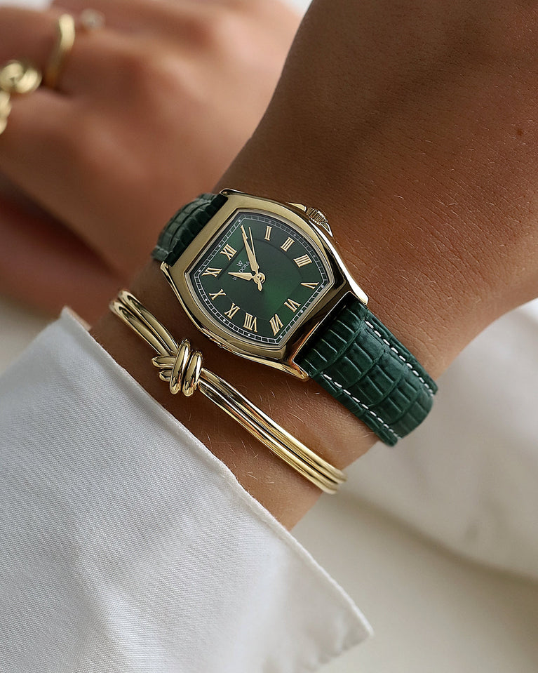  A square womens watch in 22k gold plated 316L stainless steel from Waldor & Co. with domed mineral glass dial. Seiko movement. The model is Constant 36 Laglio.