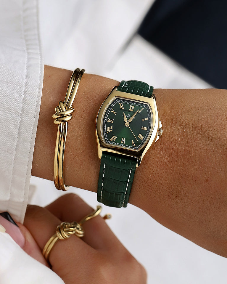 A Bangle in 14k-gold plated 316L stainless steel from Waldor & Co. One size. The model is Dual Knot Bangle Polished.