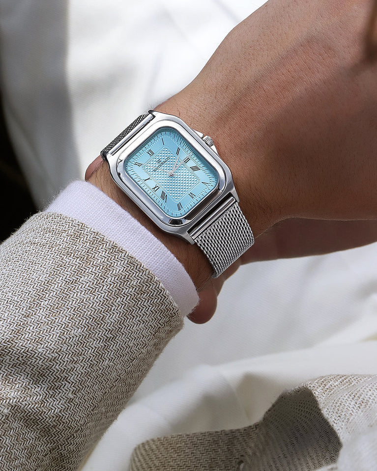  A square mens watch in silver from Waldor & Co. with light blue dial. Seiko movement. The model is Montel 40 Camogli.