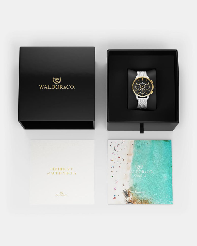 A round womens watch in14k gold-plated 316L stainless steel from Waldor & Co. with black dial  and a second hand. Seiko movement. The model is Epoch 36 Formentera 36mm.
